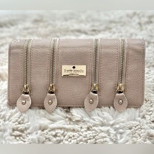 Kate Spade wallet. Pink and gold with zipper details.